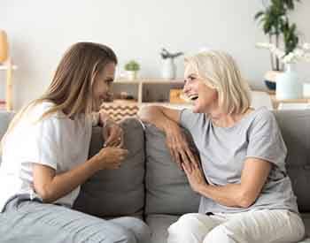 Ladies converse on couch