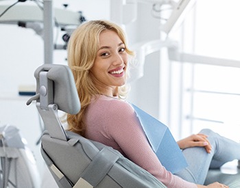 Closeup of smiling patient sitting in treatment chair