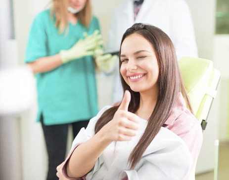 Fort Smith patient giving thumbs up after whitening treatment
