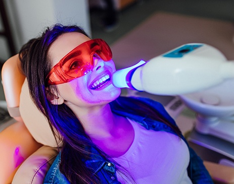 A woman getting professional teeth whitening