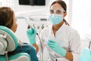 Dentist taking break from work to smile for camera.